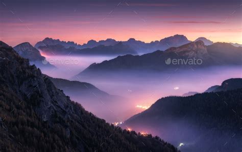 Mountains In Fog At Beautiful Night In Autumn In Dolomites Italy Stock