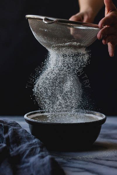 The Picture Pantry Food Stock Photo Library Sifting Flour Into A Bowl