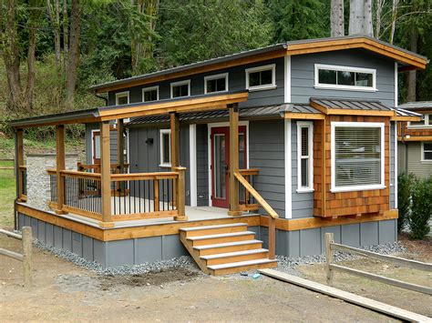 Farmhouse plans are typically frame home designs with large front porches that often wrap around and occasionally extend to the rear as well. TINY HOUSE TOWN: Wildwood Lakefront Cottage (400 Sq Ft)