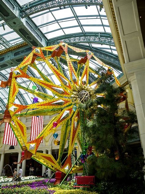An Indoor Garden With Fountains And A Huge Wheel In Las Vegas Nevada