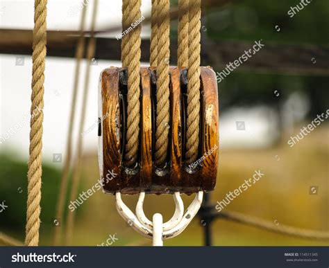 Old Wooden Block With Rope Block And Tackle Stock Photo 114511345