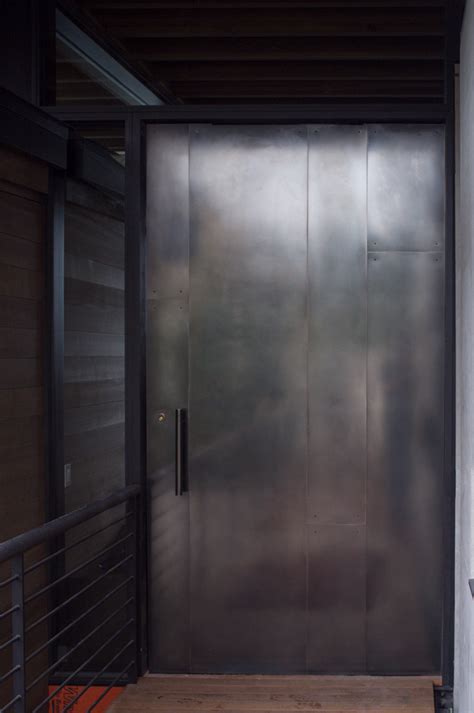 The new design enhances the overall modern aesthetic. Blackened stainless steel door - Pivot