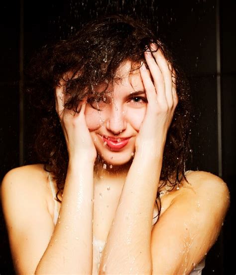 Premium Photo Young Woman Taking A Shower