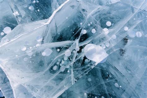 Beautiful Ice Of Lake Baikal With Abstract Cracks And Frozen Air