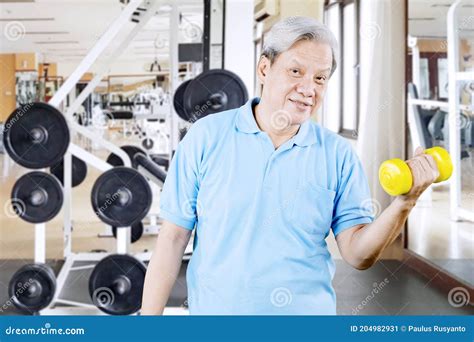 Happy Old Man Exercise With Dumbbell In Gym Center Stock Image Image