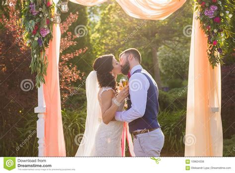 Just Married Couple In Love Under Arch Outdoors Stock Photo Image Of