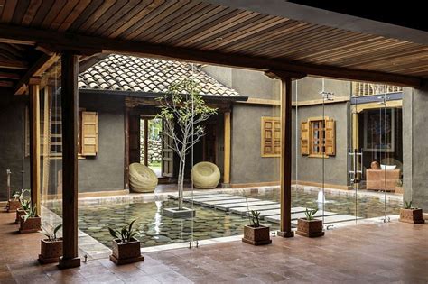Central Courtyard Of The Home With A Reflective Pond And Walkway