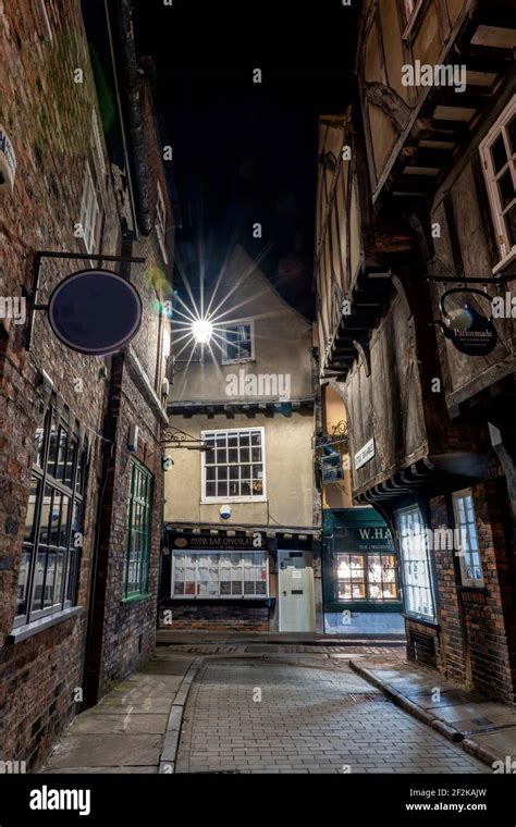 The Shambles In York England Historic Old Cobbled Street Of Leaning