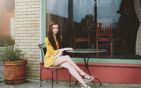 A Girl Sitting At A Sidewalk Cafe Table Wallpapers And Images