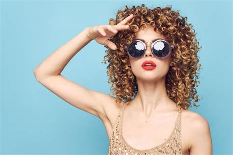 Premium Photo Portrait Of A Woman Red Lips Dark Glasses Curly Hair Model Heart Glasses Blue