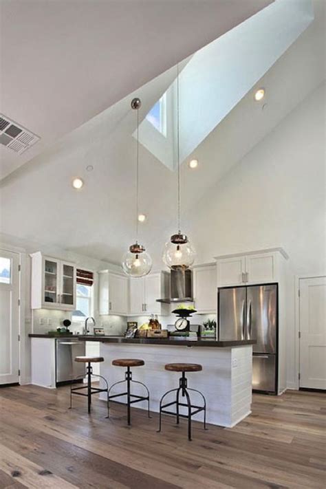 We love the modern industrial feel of this space, starting with the hanging light fixtures and going to the appliances. u shaped kitchens with vaulted ceilings | ... high vaulted ...