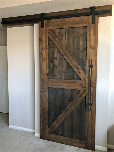 Classic Barn Door Design In Rustic Knotty Alder Slightly Darker Stain