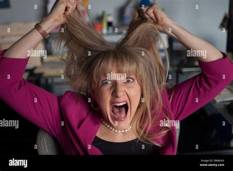 Woman Pulling Her Hair Out Stock Photo Alamy