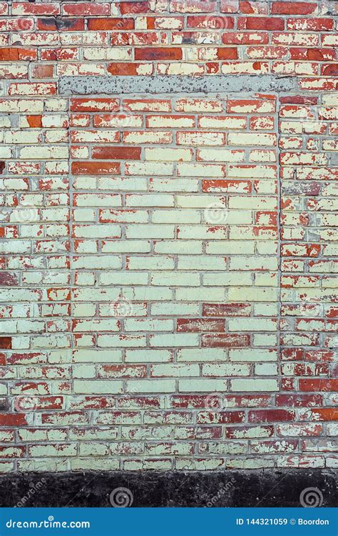 Shabby Building Facade Of Brick Wall With Damaged Plaster And Immured