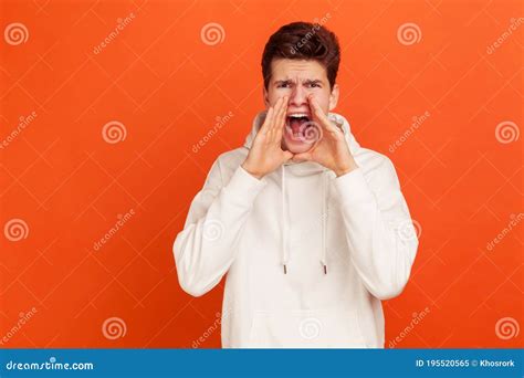 Angry Scared Teenager In Casual White Hoodie Loudly Screaming Widely