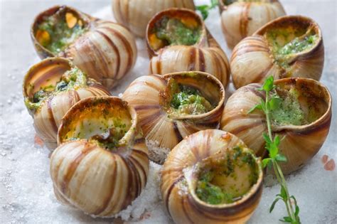 Premium Photo Baked Snails With Garlic Butter And Fresh Herbs