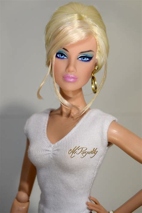 a barbie doll with blonde hair and blue eyes