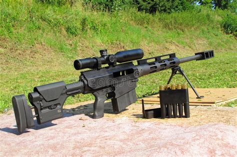 The 50 caliber sniper rifle is the largest caliber rifle available to american citizens. Sniper Rifle Caliber .50 BMG With Ammo Stock Photo - Image ...