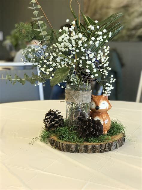 You can just stick a bunch of the straws with the animals glued on out of a simple white or chocolate cake and it looks darling. Woodland themed centerpiece | Baby shower woodland theme ...