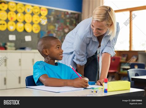 Teacher Helping Young Image And Photo Free Trial Bigstock