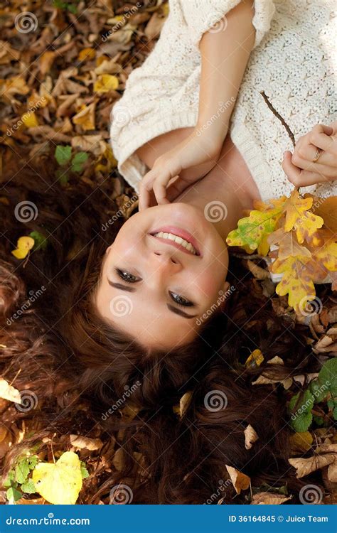 Woman Lying On Autumn Leaves Outdoor Portrait Stock Image Image Of