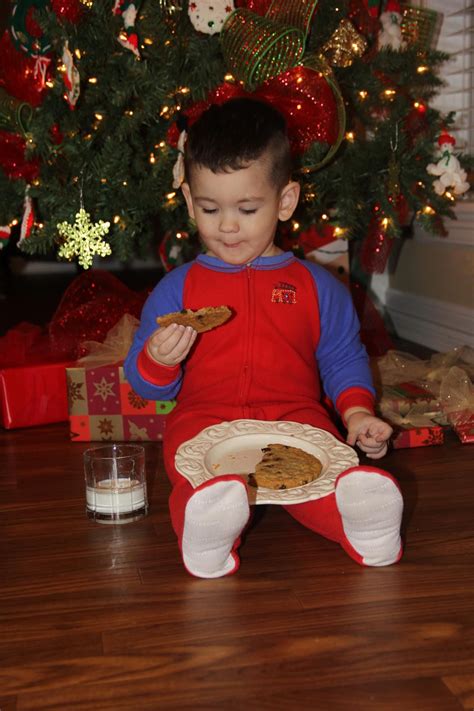 Cute Christmas Picture Of Toddler Eating Santas Cookies And Drinking