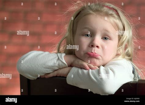 Portrait Of A Caucasian Little Girl Pouting And Making A Face For The