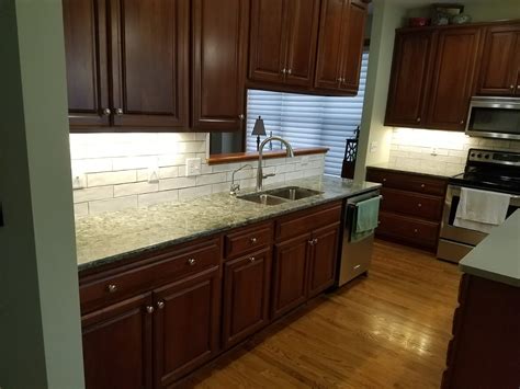 Kitchen With Cherry Cabinets And Green Accents Allrounder Remodeling Inc