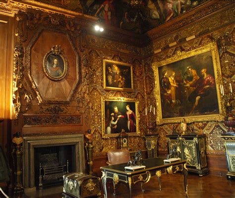 An Ornately Decorated Room With Paintings On The Walls