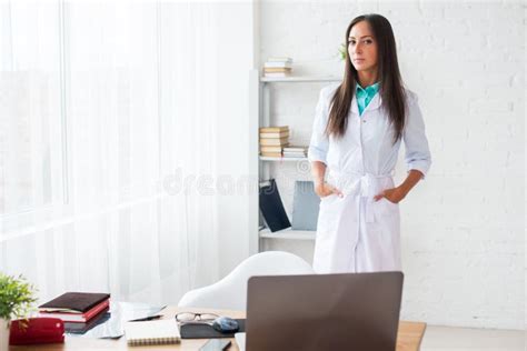 Portrait Of Young Woman Doctor With White Coat Stock Photo Image Of
