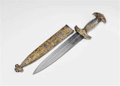 A 19th Century Gilt And Engraved Steel Swiss Dagger Lot 465