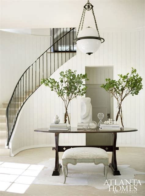 Make yours a little safer with a newel post lamp. Image result for round industrial entry table | Staircase design, Foyer design, Interior design