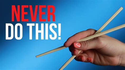 Stiffen your hand for a firm grip. How To Properly Hold Chopsticks - YouTube