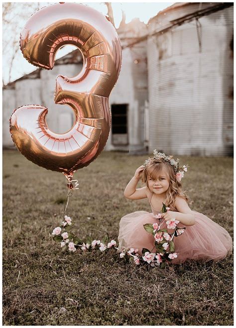 an adorable birthday photoshoot with mylar balloons flower crowns and bubbles love inc