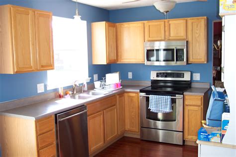 In one kitchen cabinet, do not use more than two colors. Kitchen Decoration Gray Blue Walls White With Small Color ...
