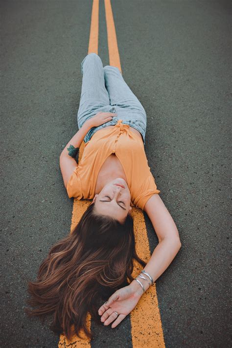 Woman Lying On The Road · Free Stock Photo