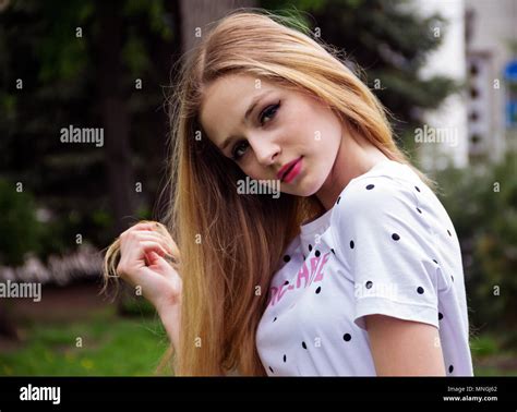 Portrait Of A Cute Russian Blonde Girl In A City Park Stock Photo Alamy