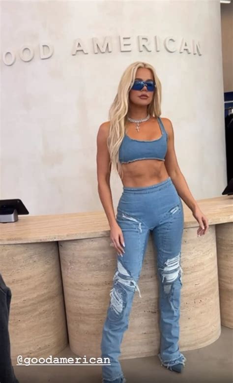 khloe kardashian shows off her ripped stomach in tight jeans and crop top as she promotes good