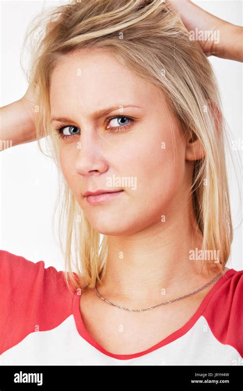 Young Blonde Woman With Hands In Hair Stock Photo Alamy