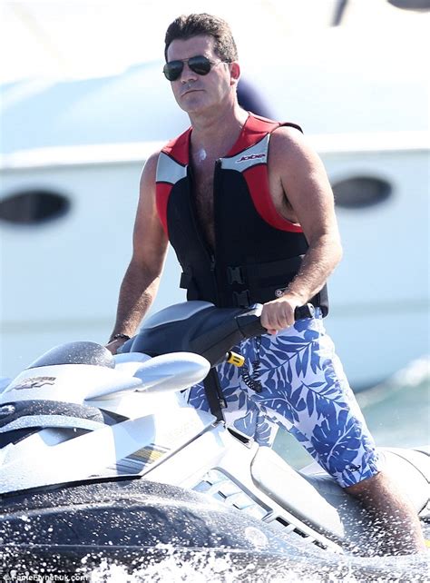 Simon Cowell Shows Off In Front Of His Bevy Of Girls As He Spends The Afternoon Circling His