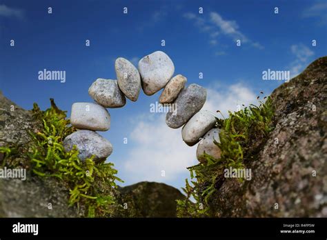 Balanced Stone Arch Of Pebbles As Zen Symbol For A Bridge Or A Gate