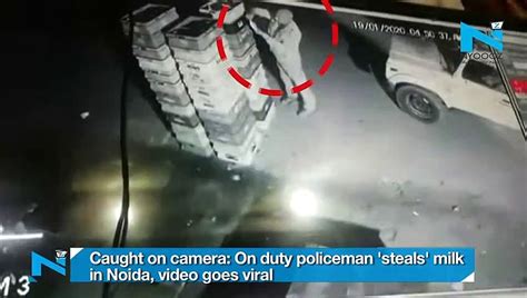 Caught On Camera On Duty Policeman Steals Milk In Noida Video Goes Viral Video Dailymotion