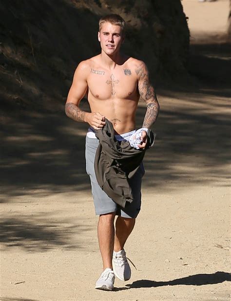justin bieber flashes abs after hiking excursion in hollywood hills entertainment tonight
