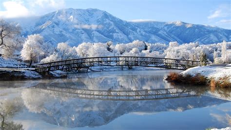 Bridge Snow Covered Mountains And Trees Body Of Water Hd Wallpaper