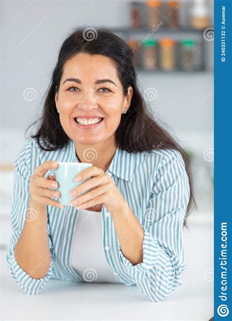 Charming Beautiful Mature Woman Drinking Fresh Morning Coffee Stock