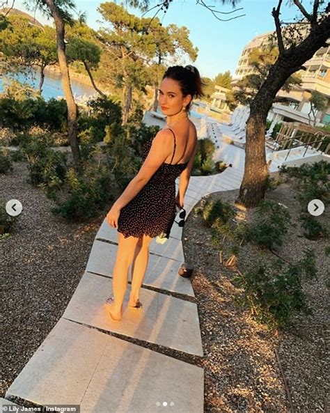 Lily James Looks Sensational In A Black Bandeau Bikini During Sun