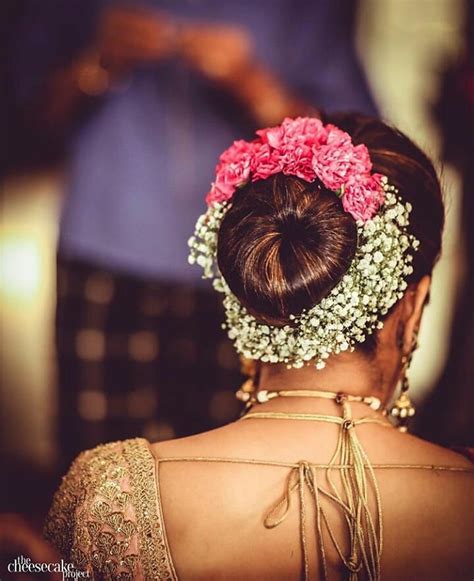 If you're going for a traditional look for your wedding reception there's probably no better hairstyle than a floral bun. 11 Hottest Indian Bridal Hairstyles For Your Wedding