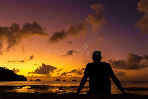 A Guy Silhouette Enjoys A Beautiful Beautiful Sunset On A Tropical