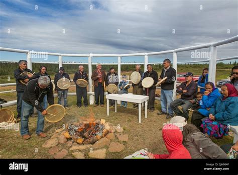 Indigenous Dene People Gathered Around Fire For Traditional Prayer Drum