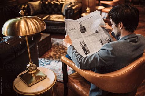 Businessman Reading A Newspapers Del Colaborador De Stocksy Lumina